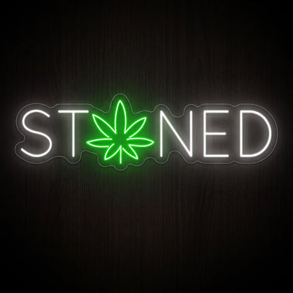 Stoned LED neon sign featuring white lettering with a green cannabis leaf on a clear acrylic backing.