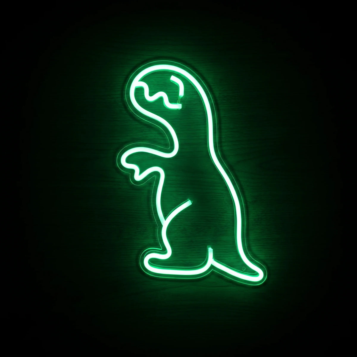 Tiny T-Rex LED Neon Sign featuring a bright green dinosaur outline on clear acrylic backing.