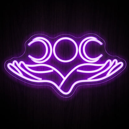 Triple Moon Goddess LED Neon Sign featuring purple crescent and full moon symbols above two open hands.