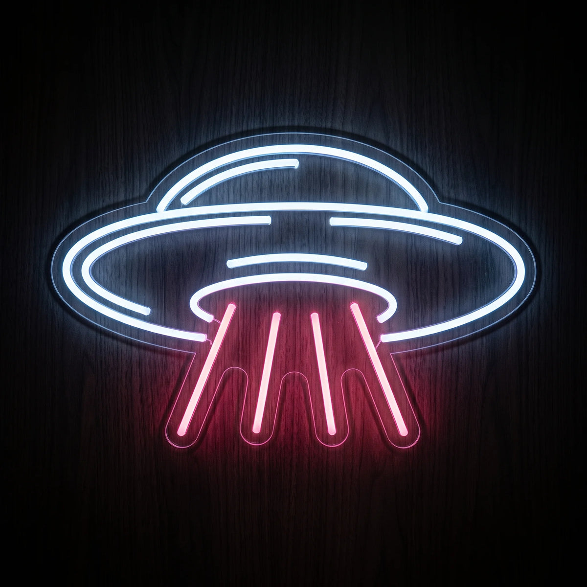 UFO Beam LED neon sign featuring a cool white flying saucer outline with a bright pink beam shining downward.