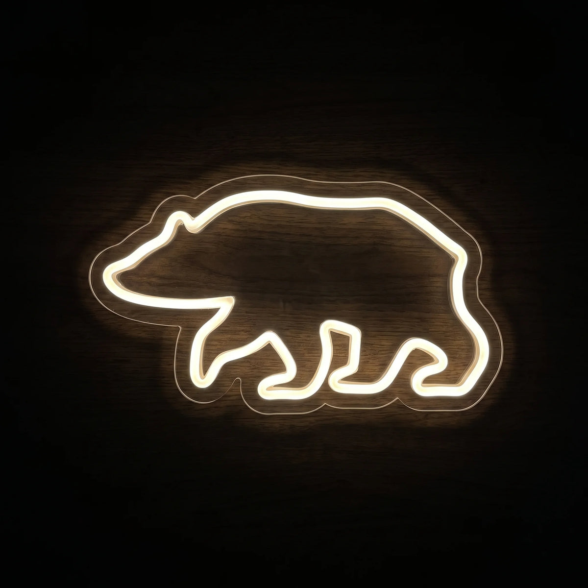 Walking Bear LED Neon Sign featuring a minimalist warm white bear outline on clear acrylic backing.