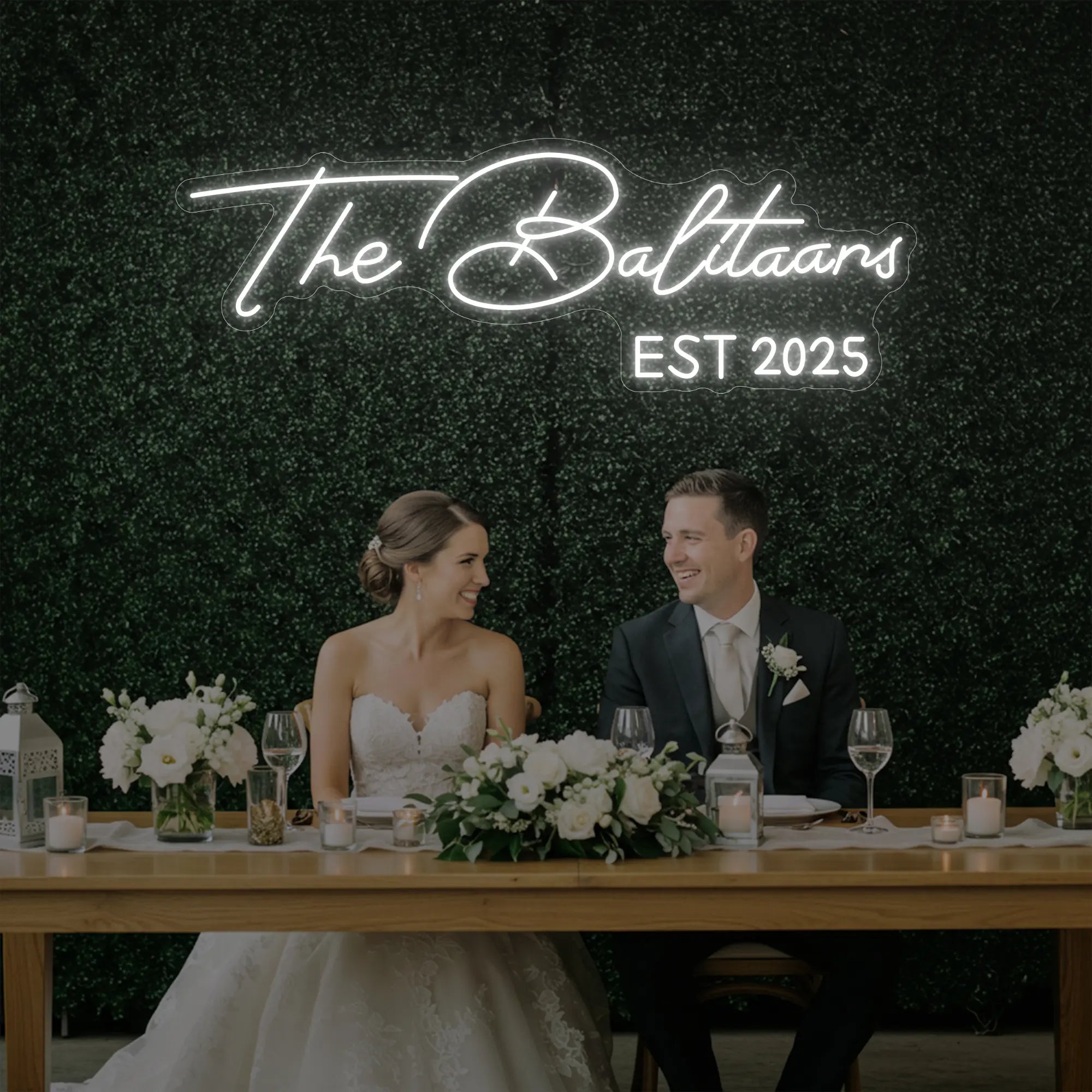 Photo of the 'Wedding Last Names Custom Neon Sign V1' neon sign glowing in cool white against a styled interior wall.