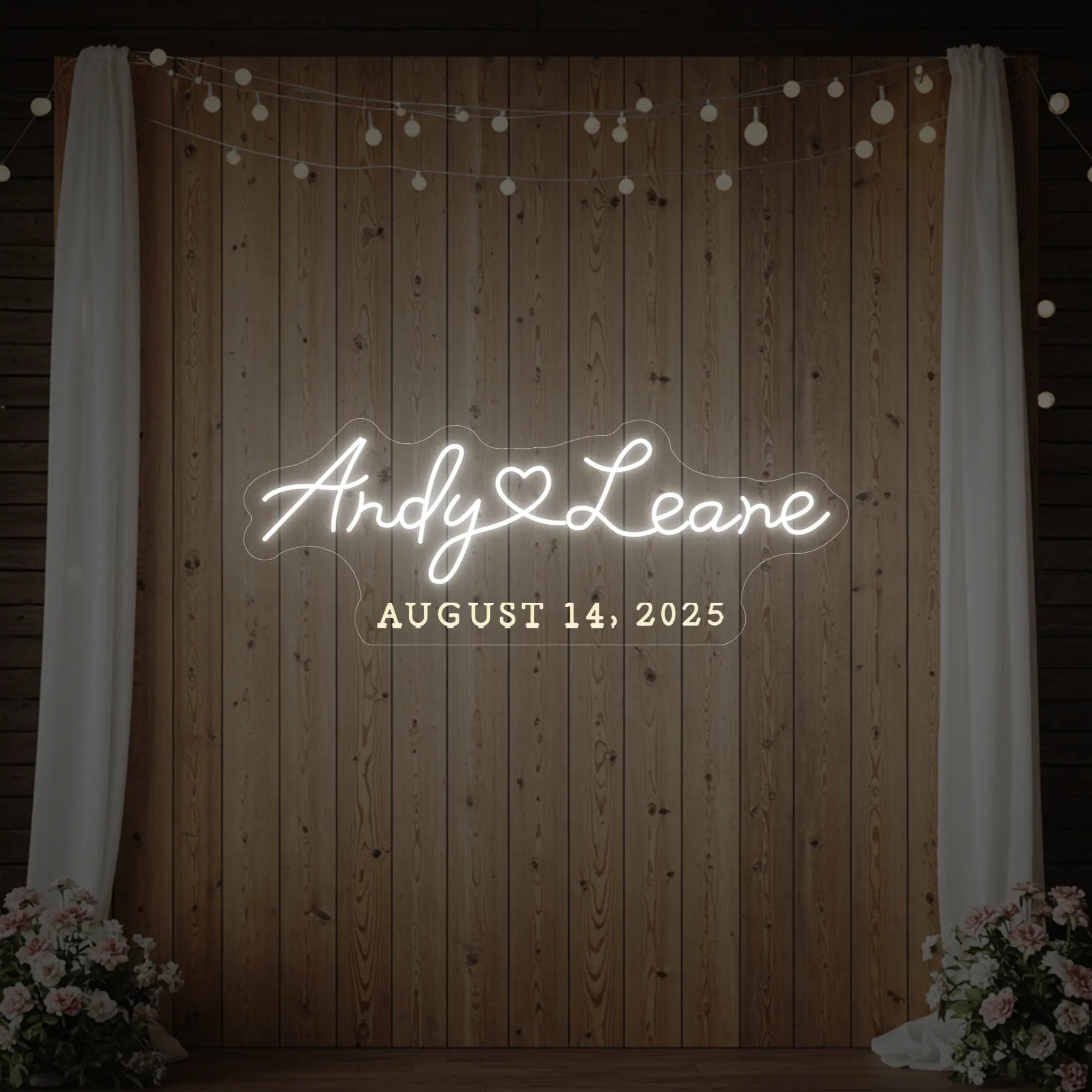 Photo of the 'Wedding First Names Custom Neon Sign' neon sign glowing in cool white against a styled interior wall.