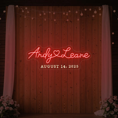 Photo of the 'Wedding First Names Custom Neon Sign' neon sign glowing in red against a styled interior wall.