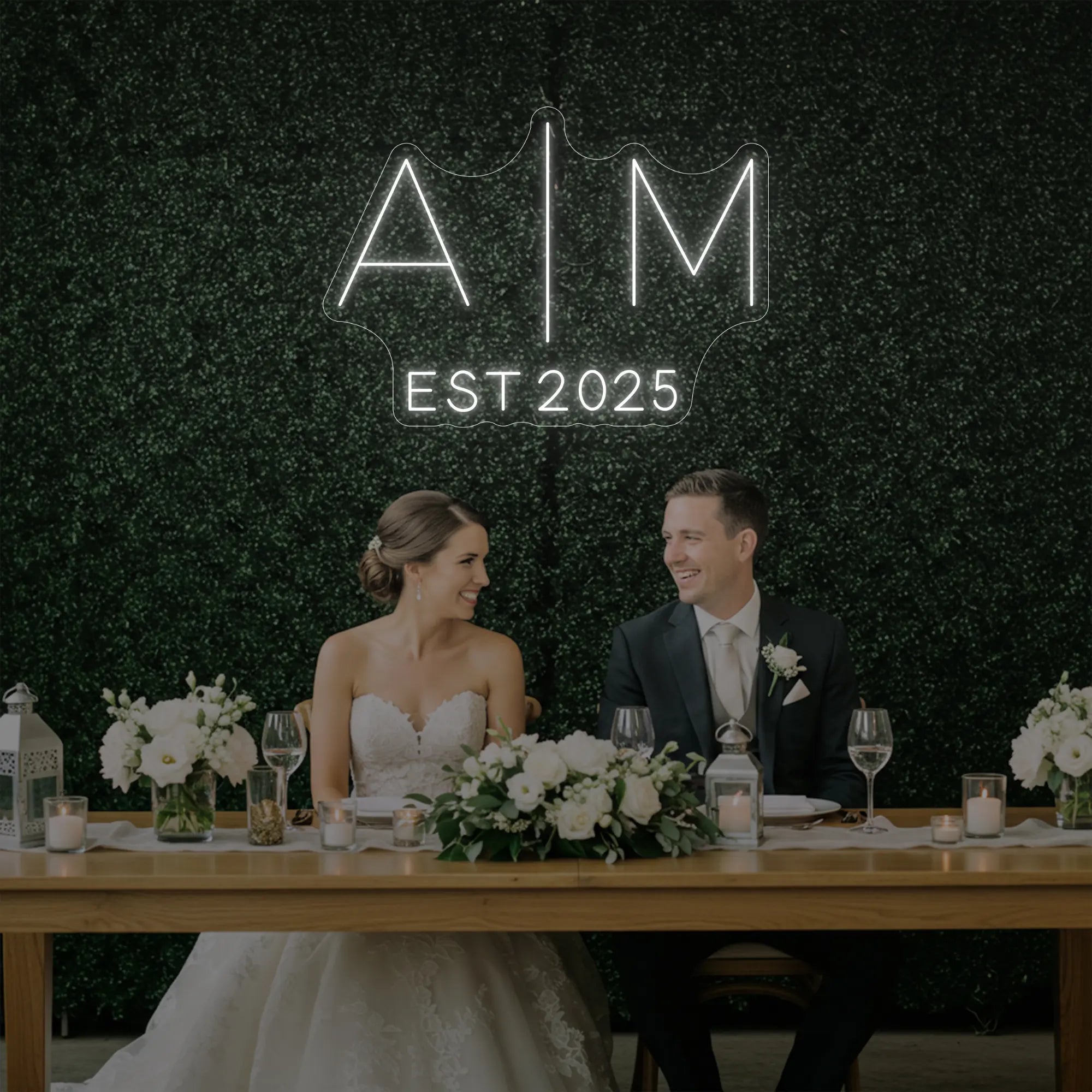 Photo of the 'Wedding Initials Custom Neon Sign V4' neon sign glowing in cool white against a styled interior wall.