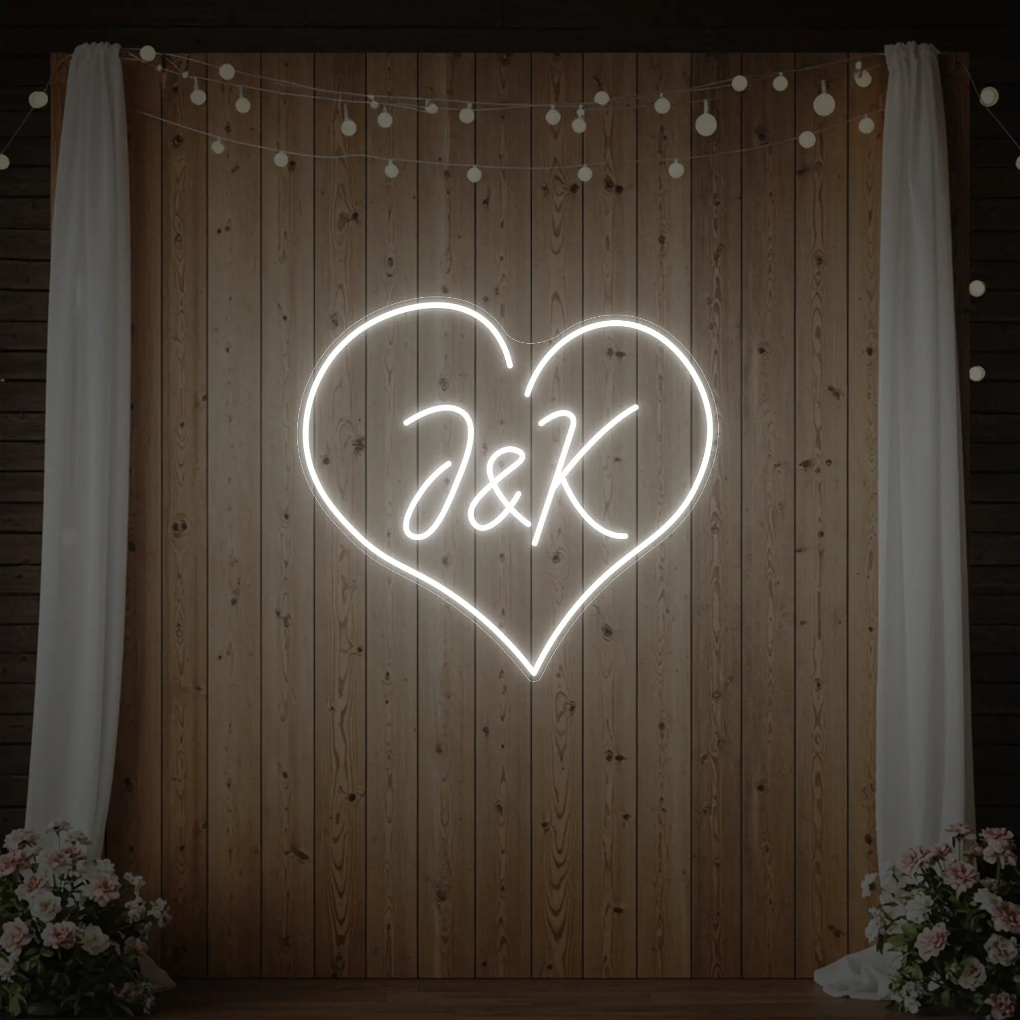 Photo of the 'Wedding Initials Custom Neon Sign V5' neon sign glowing in cool white against a styled interior wall.