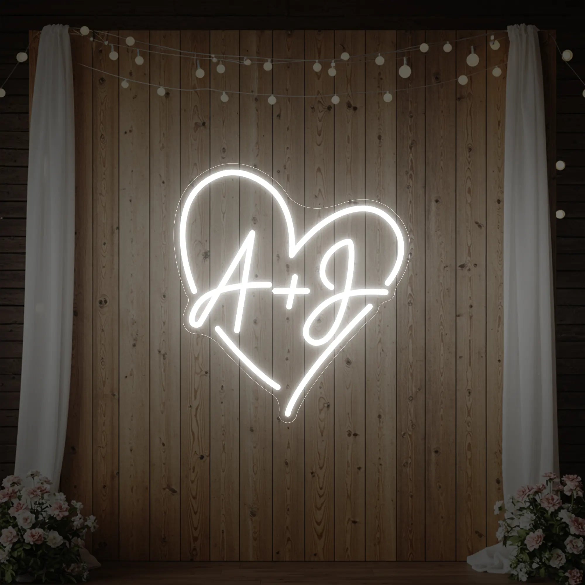 Photo of the 'Wedding Initials Custom Neon Sign V7' neon sign glowing in cool white against a styled interior wall.