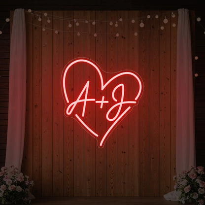 Photo of the 'Wedding Initials Custom Neon Sign V7' neon sign glowing in red against a styled interior wall.