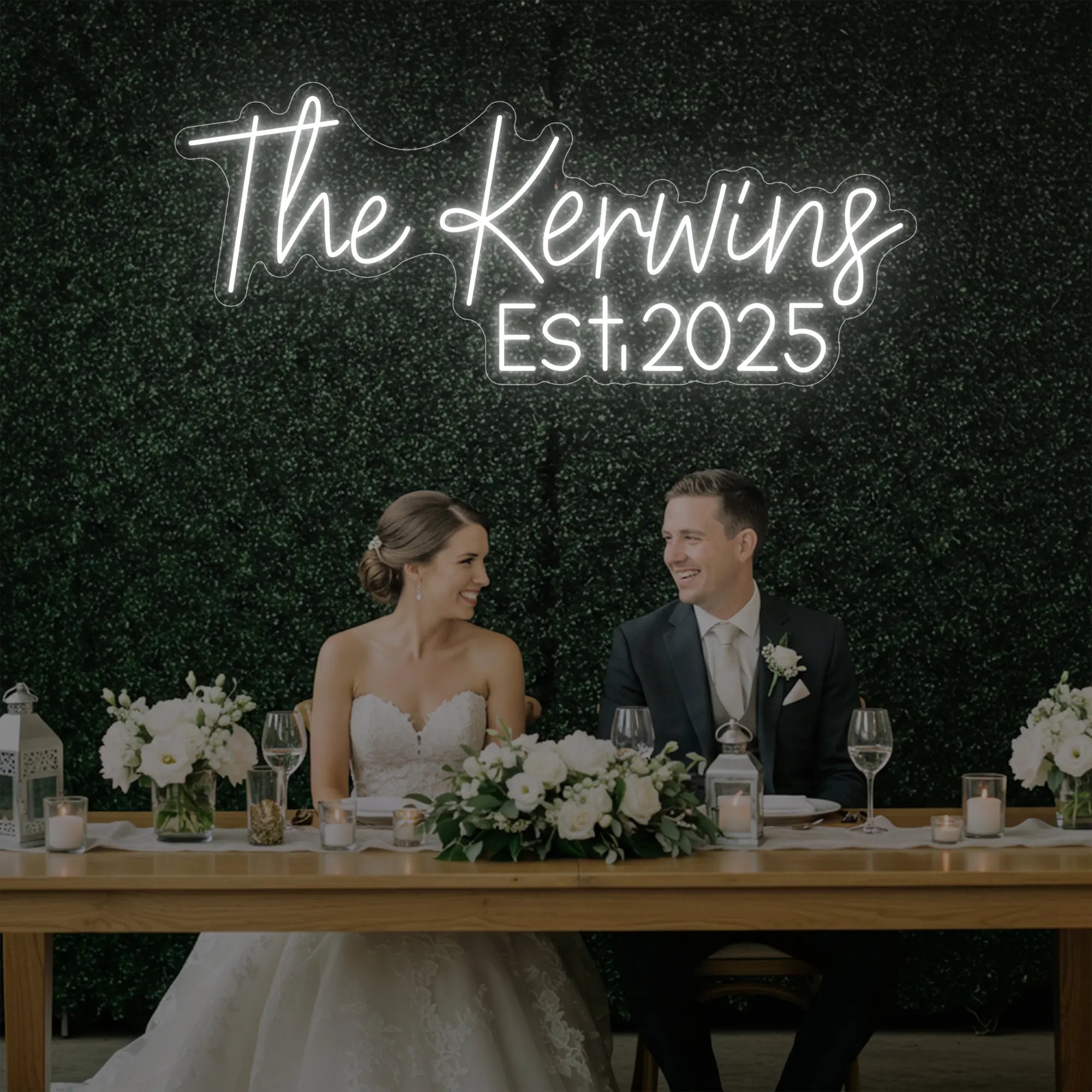 Photo of the 'Wedding Last Names Custom Neon Sign V5' neon sign glowing in cool white against a styled interior wall.