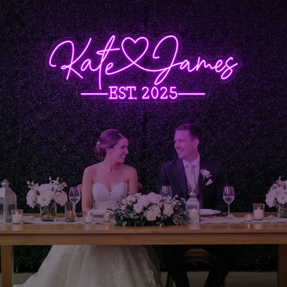 Photo of the 'Wedding Names Custom Neon Sign' neon sign glowing in deep pink against a styled interior wall.