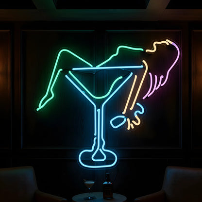 Photo of the 'Woman in Martini' neon sign glowing in multi-color against a chic cocktail lounge-inspired wall.