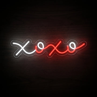 XOXO Script LED Neon Sign featuring flowing white and red XOXO lettering on a clear acrylic backing.