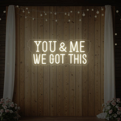  'You & Me We Got This' neon sign glowing in warm white against a styled interior wall.