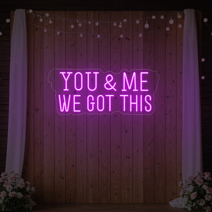  'You & Me We Got This' neon sign glowing in deep pink against a styled interior wall.